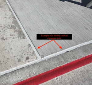 An image showing a good caulking on a sidewalk by C&D Commercial Services